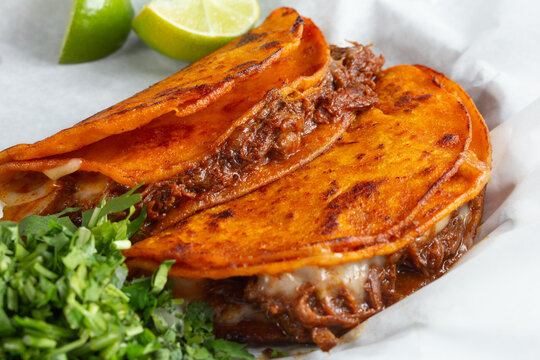 A view of two birria tacos.