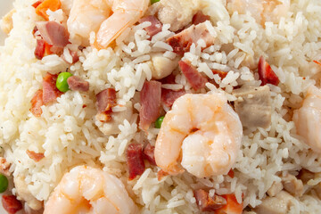 A top down view of a plate of yang chow fried rice, as a background.