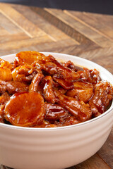 A view of a bowl of wok-fried scallop shrimp beef.