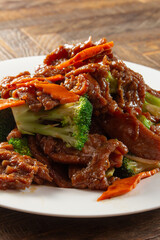 A view of a plate of beef broccoli.