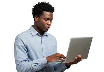 Young black man focused on laptop screen working or studying in a studio setting transparent background