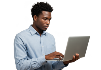 Young black man focused on laptop screen working or studying in a studio setting transparent background