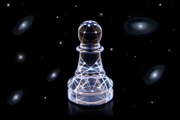 A clear glass chess pawn piece against a black background with stars and galaxy like shapes present