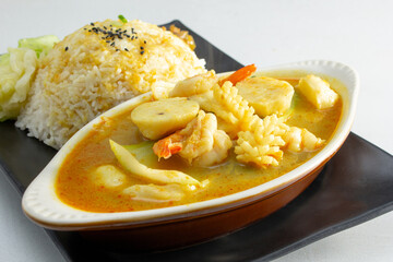 A view of a curry seafood rice entree.