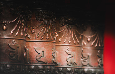 Intricate, symmetrical floral patterns adorn a smooth, dark wooden surface within the Beijing...
