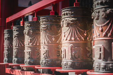 Red-lacquered gates frame a symmetrical courtyard within Beijing's Prince Kung's Palace Museum,...