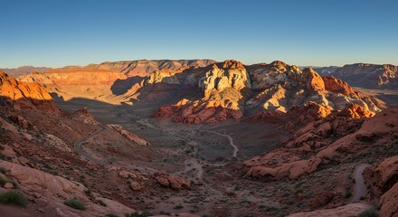 Panoramic view of rocky mountain range at sunrise under a clear sky