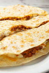A closeup view of a chorizo and egg quesadilla.