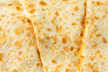 A top down view of a quesadilla, as a background.