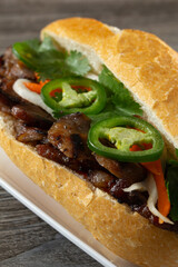 A closeup view of a pork banh mi.