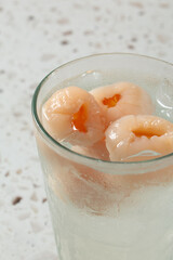 A closeup view of an iced lychee drink.