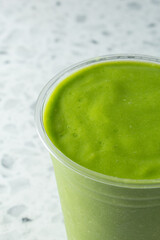 A closeup view of a green smoothie.