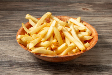 A view of a bowl of french fries.