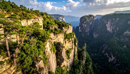 Obraz premium A vibrant mountain range with lush greenery atop steep cliffs and valleys