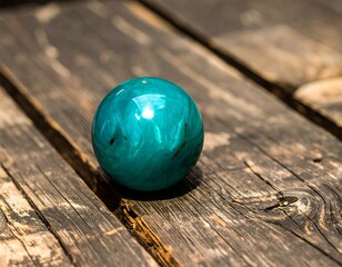 Teal sphere on weathered wood (1)