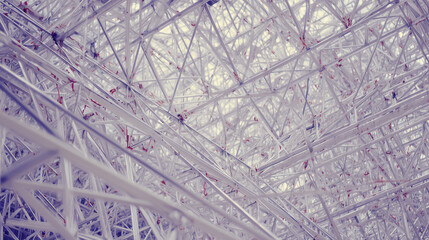 girders. Steel frame structure under construction with ambient lighting and minimal background, real-estate listings.