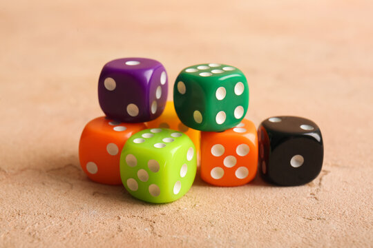 Different dices on beige background