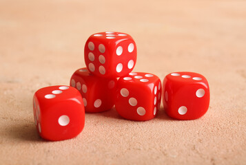Red dices  on beige background