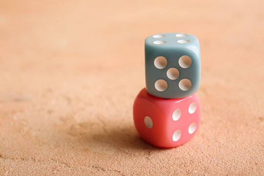Different dices on beige background