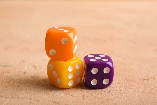Different dices on beige background
