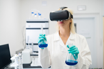 Professional scientist using VR headset in chemistry lab for interactive molecular modeling, representing future of research and immersive technology.