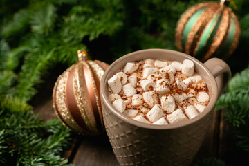 Cup of hot chocolate with marshmallow. Hot winter drinks in christmas environment. Cozy winter mood.