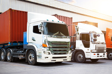 Semi Trailer Trucks on The Parking Lot at The Warehouse. Shipping Cargo Container. Trucks Loading Goods at Dock Warehouse. Distribution Warehouse. Big rig. Freight Logistics Truck Transport.
