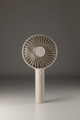 Portable mini fan sleek design on gray background