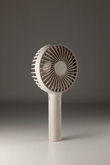 Portable mini fan sleek design on gray background