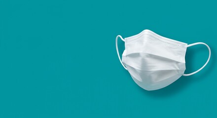 White medical mask isolated on blue background healthcare and protection concept