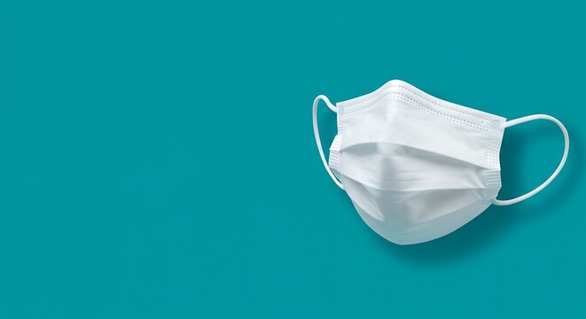 White medical mask isolated on blue background healthcare and protection concept - Powered by Adobe