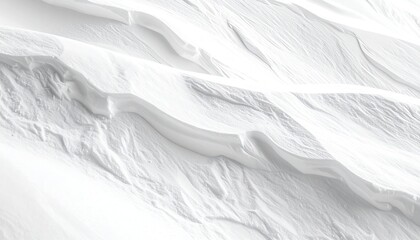 Close-up aerial view of rippling, snow-covered landscape, textured and ethereal
