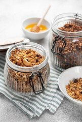 Granola with nuts and dried fruits in glass jars