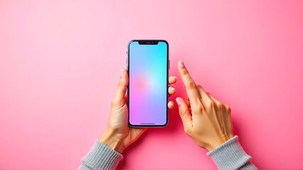 Woman holding smartphone in hands against bright pink background