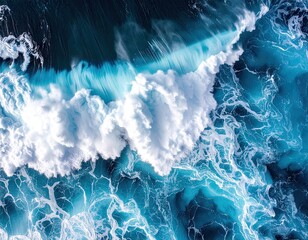 Aerial View of Turquoise Blue Ocean Wave with White Foam Texture and Natural Sunlight Creating Abstract Patterns