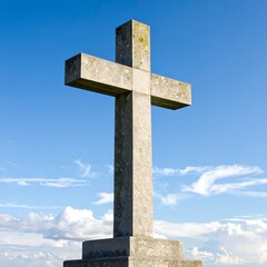 Stone cross against a vibrant sky