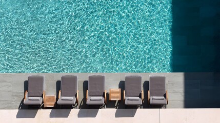 Swimming pool with sun loungers. View from above. luxury hotel resort. Aerial view of a luxury swimming pool.