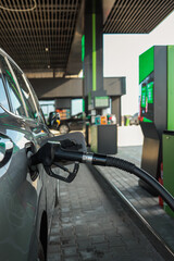 Refueling a car at a gas station