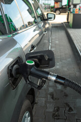 Refueling a car at a gas station