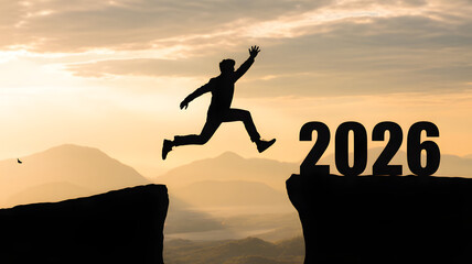 Welcome merry Christmas and happy new year in 2026,Silhouette Man jumping from 2026 cliff to 2026 cliff with cloud sky and sunlight