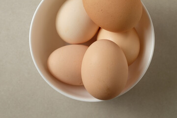 Fresh eggs in a simple bowl ready for cooking or baking delights