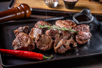 Grilled beef with chili pepper and rosemary