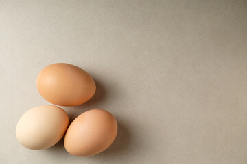 Fresh eggs resting on a smooth surface add warmth to the kitchen setting
