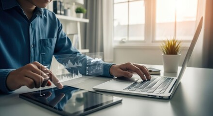 Person works on laptop/tablet; data overlay