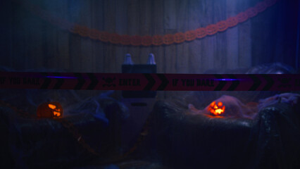 Fototapeta na wymiar Halloween Pumpkin Crime Scene with Scary Tape