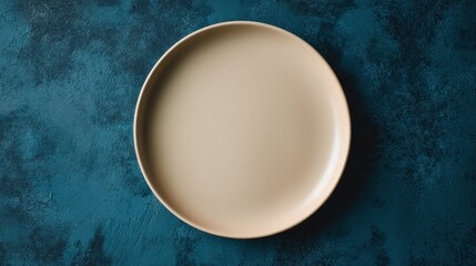 Tan plate centered on dark teal textured surface. Minimalist, elegant, and simple food photography