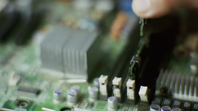 Engineer Installing RAM Module Into Motherboard Slot. Technician Upgrading Computer Hardware Memory