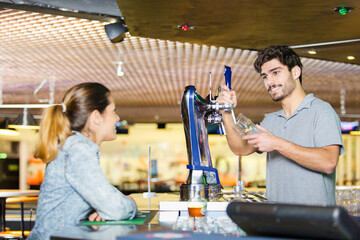 adorable blonde flirting with barman