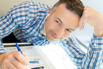 happy worker listening to music at work