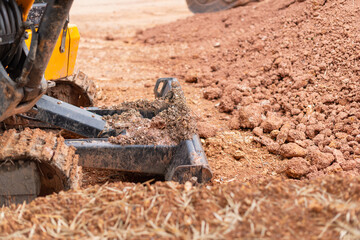 Excavation machinery operating construction site earthmoving equipment urban landscape close-up view
